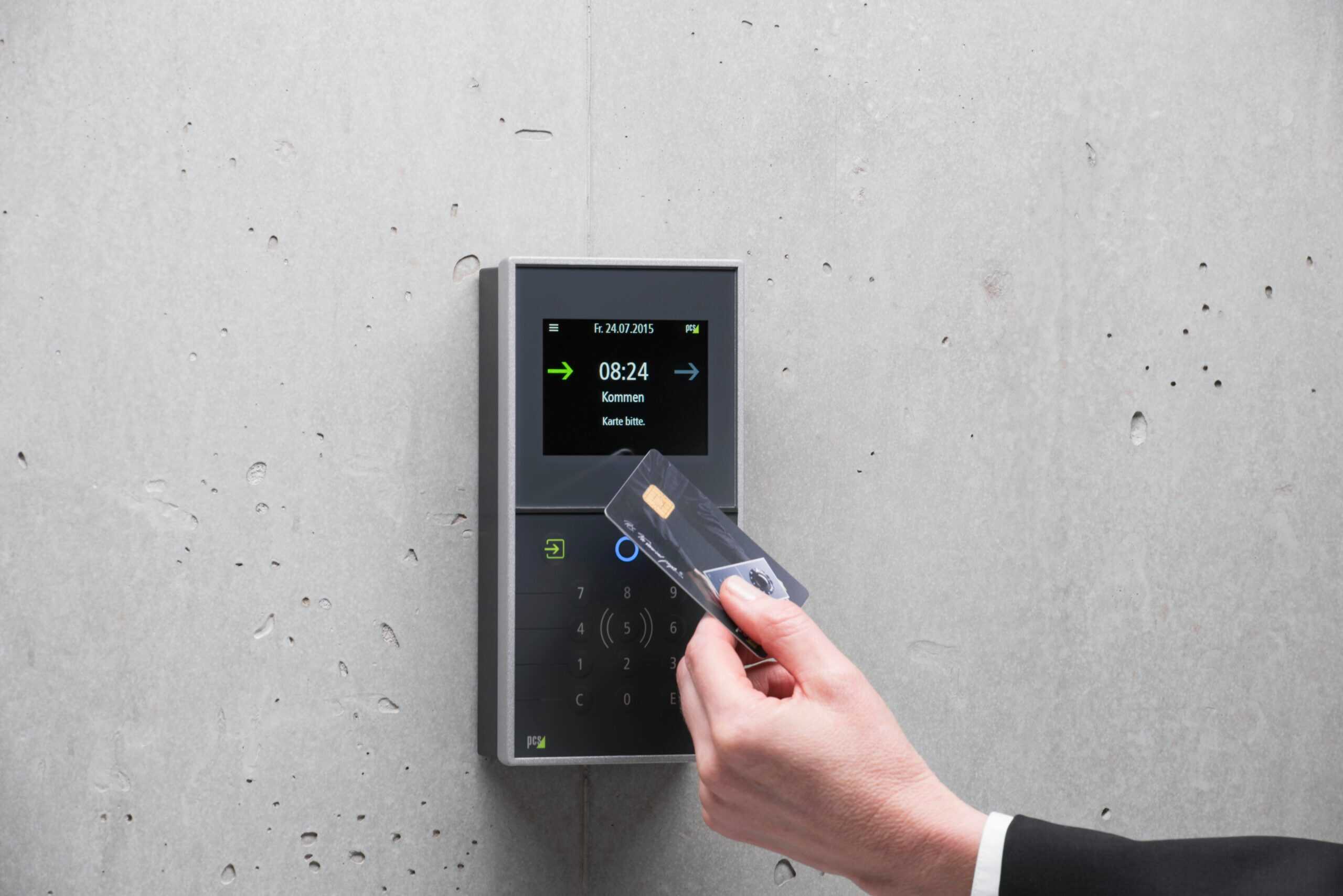 Technician installing an access control system on a commercial building in Tukwila, WA